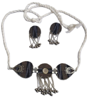 Necklace and earrings set with black and silver design on a white background