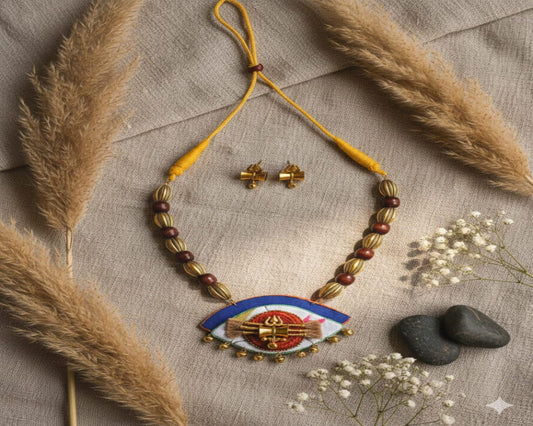 Jewelry set with necklace and DAMRU earrings.