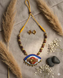 Jewelry set with necklace and DAMRU earrings.
